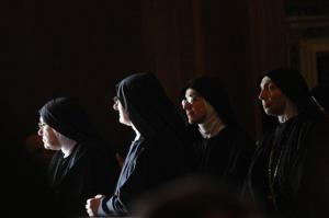 In this 2009 file photo, nuns wait for the arrival of Pope Benedict XVI in Cassino, Italy.