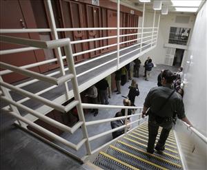 Reporters inspect one of the two-tiered cell pods in the Secure Housing Unit at the Pelican Bay State Prison near Crescent City, Calif., Wednesday, Aug. 17, 2011.